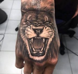 Lion Hand Tattoo